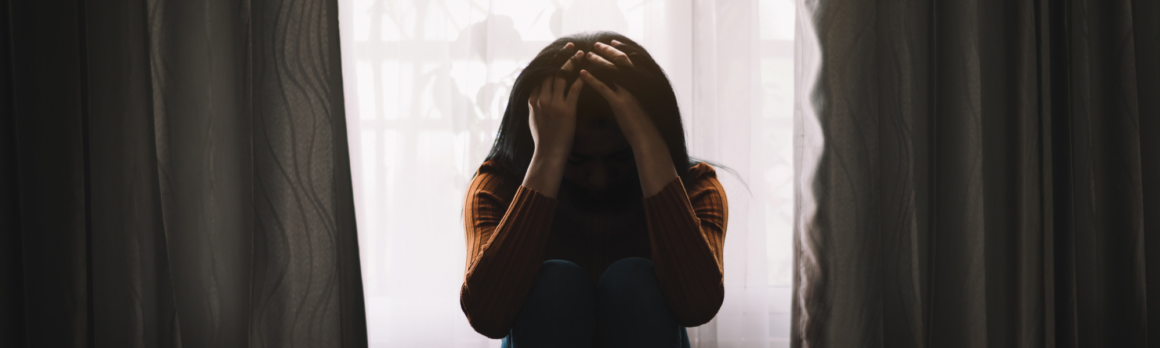 girl with head in hands, girl struggling with emotional distress, girl struggling with mental health, a girl with her head in her hands, challenges of borderline personality disorder, complexities of borderline personality disorder