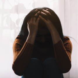 girl with head in hands, girl struggling with emotional distress, girl struggling with mental health, a girl with her head in her hands, challenges of borderline personality disorder, complexities of borderline personality disorder