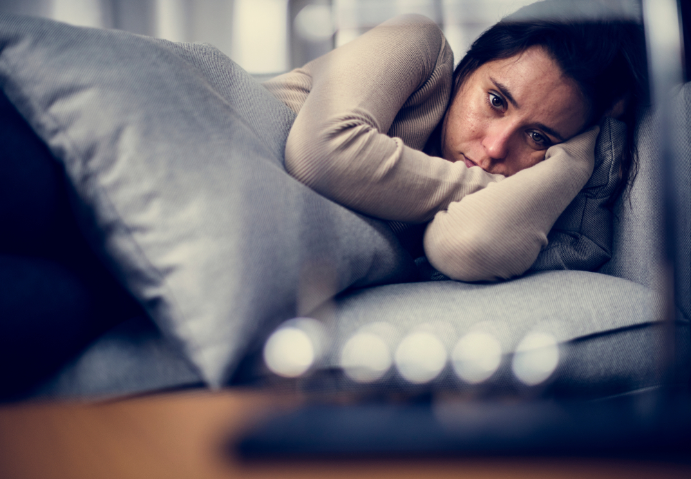 Chronically ill woman depressed in bed