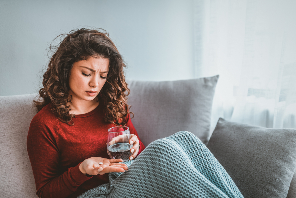 Woman taking medication to help with depression