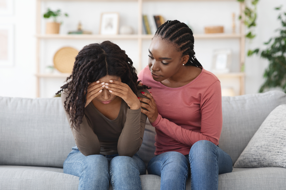 Attentive friend comforting their loved one in grief