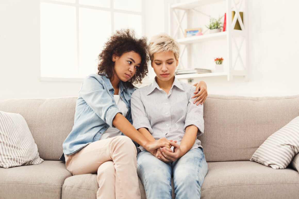 A young woman comforts friend coping with grief