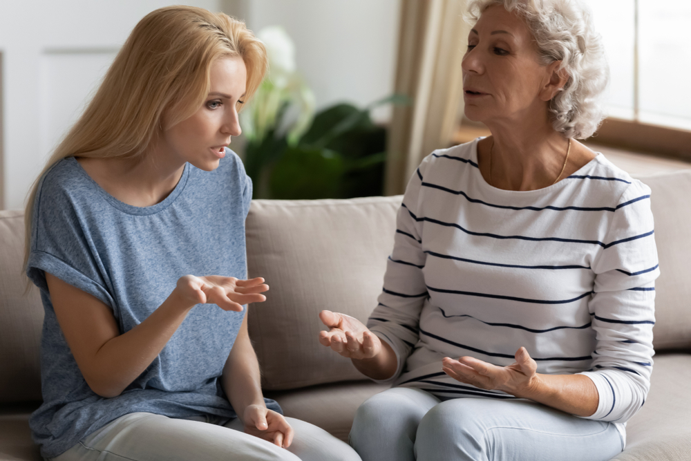 Woman arguing with her adult child who makes poor life decisions